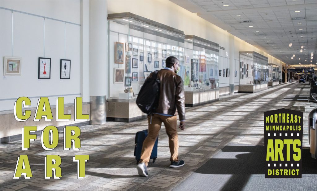 An image taken at the airport, where a figure walks down the concourse hallway. On their left is a row of display cases full of art. The words "CALL FOR ART" are at the bottom left corner of the image, and the Northeast Minneapolis Arts District's logo is at the bottom right corner.