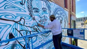 Read more about the article Two collectives join for mural at coop