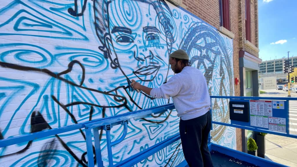 Two collectives join for mural at coop