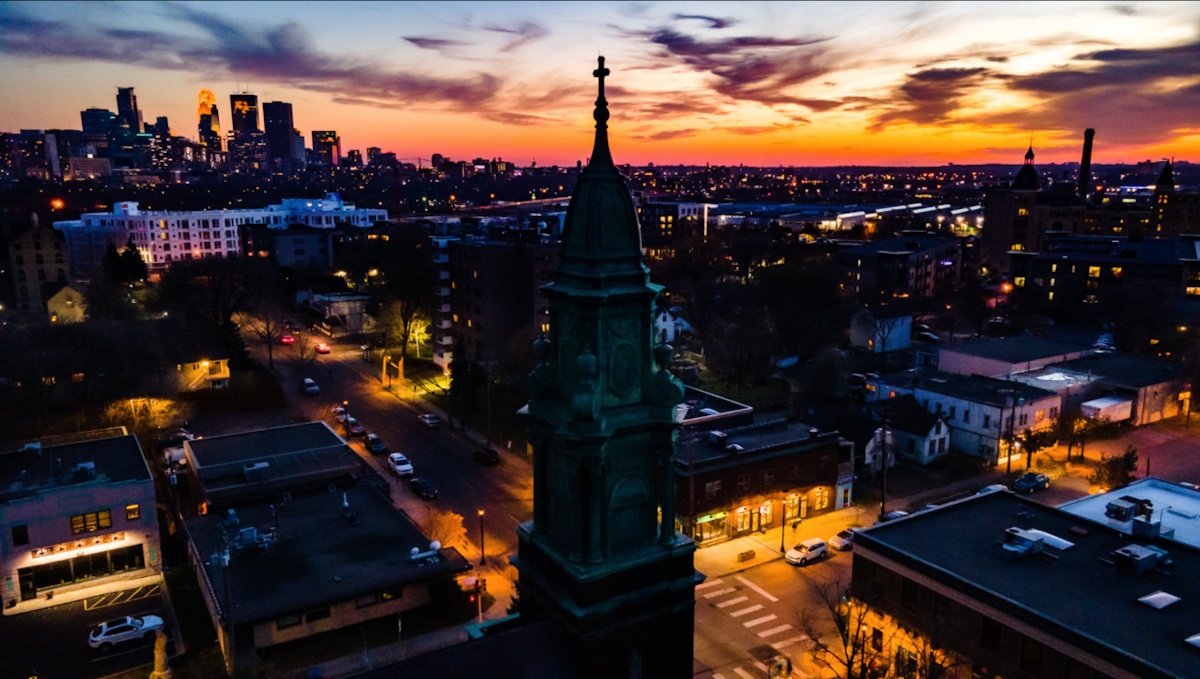Sunset photo of 13th Avenue churches and buildings.