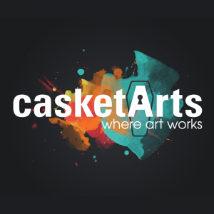 Logo for casketArts where art works featuring a coffin-shaped keyhole in the letter A over a colorful watercolor splash.