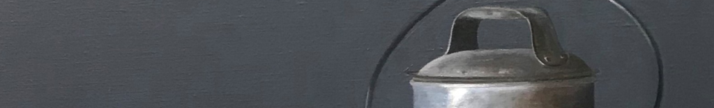 A close-up of a metal lantern against a dark background.