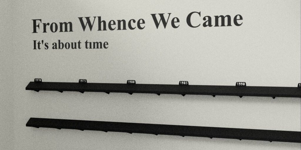 Wall display titled From Whence We Came: Its about time featuring a timeline with year markers from 1970 to 1990 above two black shelves.