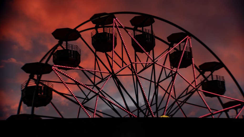The ferris wheel on the corner of Lowry and Marshall at sunset.