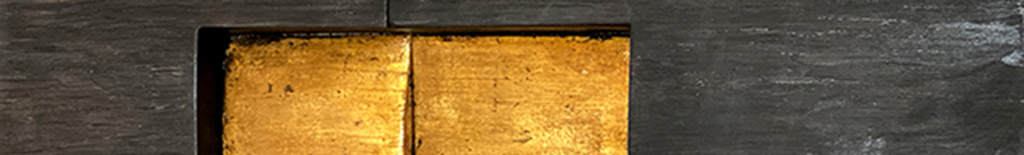 A square panel of gold leaf set within a dark, textured charcoal frame.
